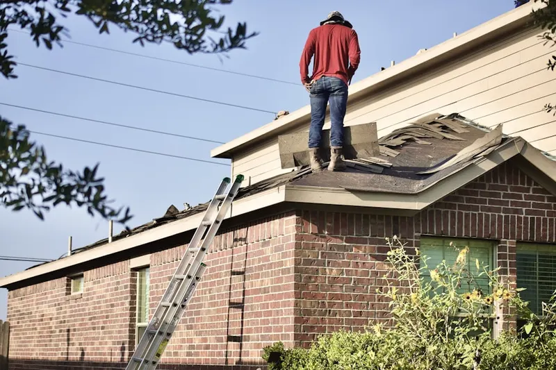 Professional roofer working on a residential roof in Valley Green